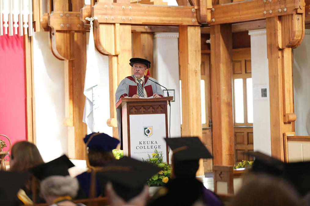 Keuka College President Jorge L. Díaz-Herrera speaking in front of an audience